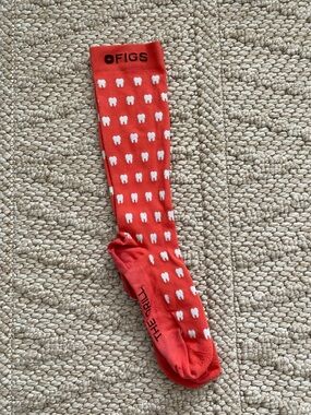 FIGS coral Sock with White Tooth Pattern